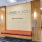 lobby wall with property name and cushioned bench