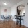 dining area next to kitchen with bar seating